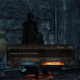 From Dark Souls 2: A message left next to a statue of a woman in a storage chamber.